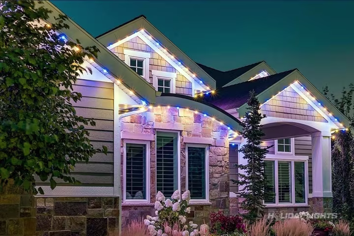 App-controlled permanent LED lighting on a New Hampshire home facade