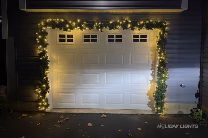 Professional residential Christmas light installation in Strafford, New Hampshire — Garage Door Garland Display