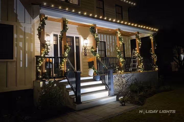 Professional residential christmas light installation in Bennington, New Hampshire — Porch Garland Decorations
