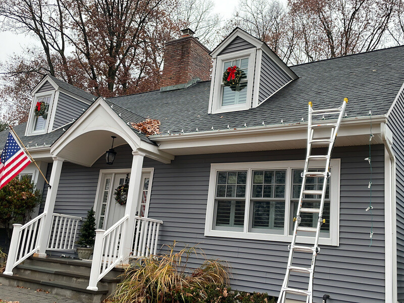 Holiday Lights Decor crew installing Christmas lights